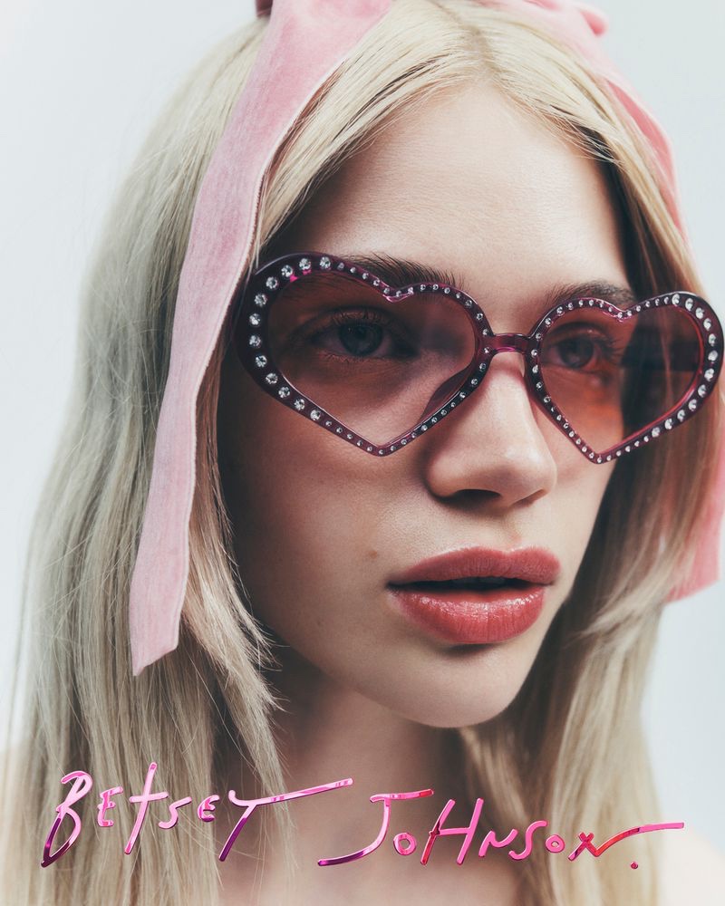 Betsey Johnson gets playful with pink heart-shaped glasses for summer 2024.