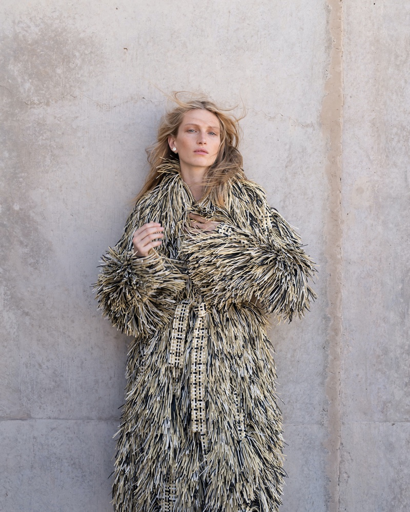 Liz Kennedy shows off an embellished coat from Bottega Veneta's winter 2024 collection.