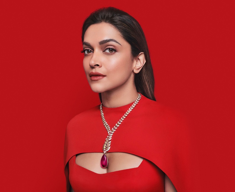 Deepika Padukone stuns in red wearing the Mochelys necklace from Cartier's Nature Savage collection.