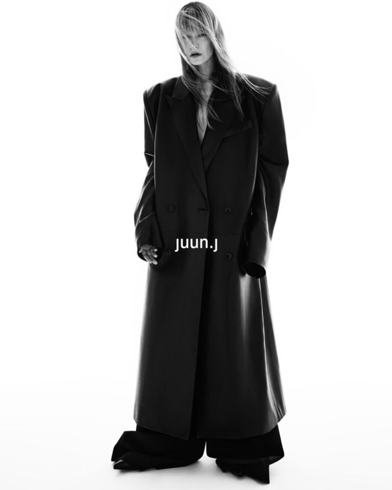 Kirsten Dunst models an oversized coat for Juun.J's fall-winter 2024 campaign.