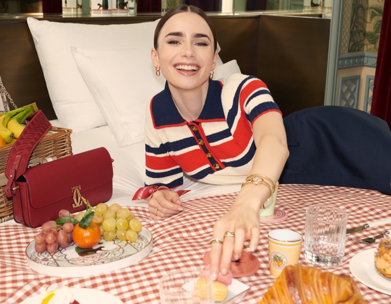 All smiles, Lily Collins poses with Cartier accessories for summer 2024.