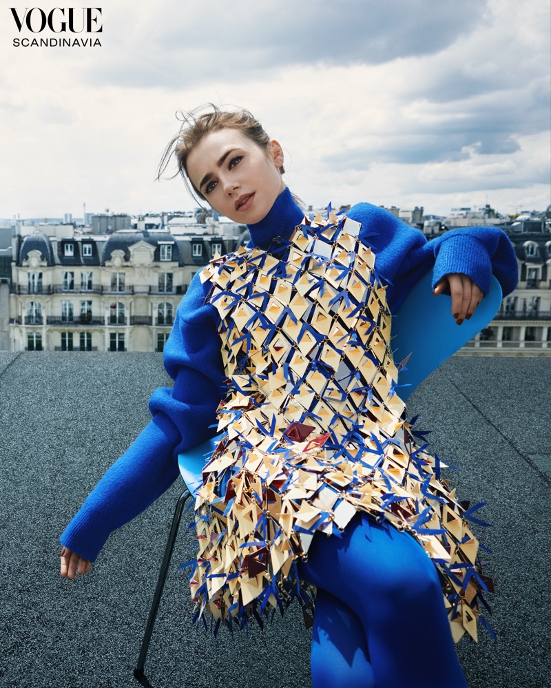 Striking a pose, Lily Collins shows off a vibrant blue ensemble.