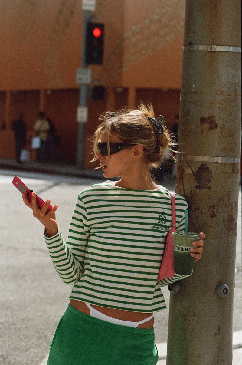 Paige Reifler models Sporty & Rich's striped shirt from the new Health Drop.