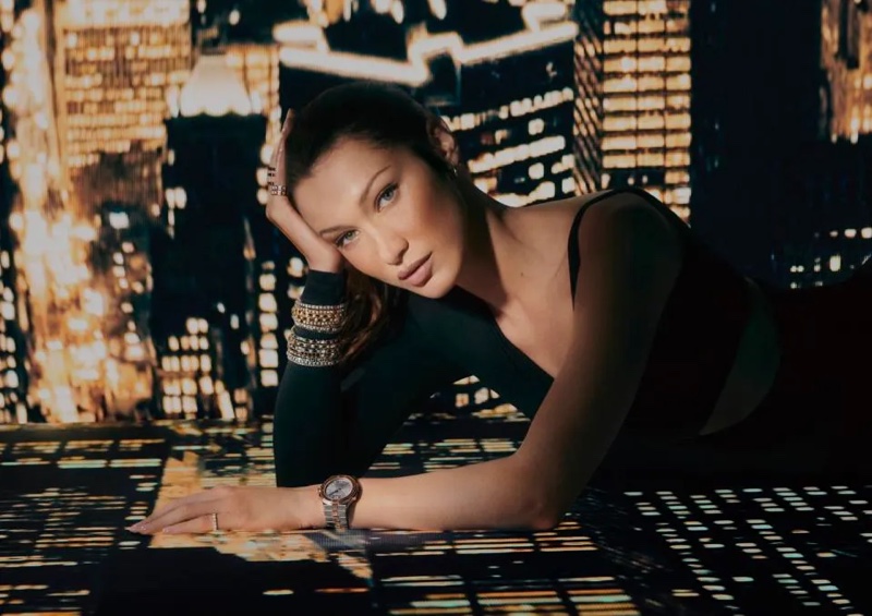 With stacked bracelets and a watch, Bella Hadid fronts Chopard's 2024 Ice Cube ad.