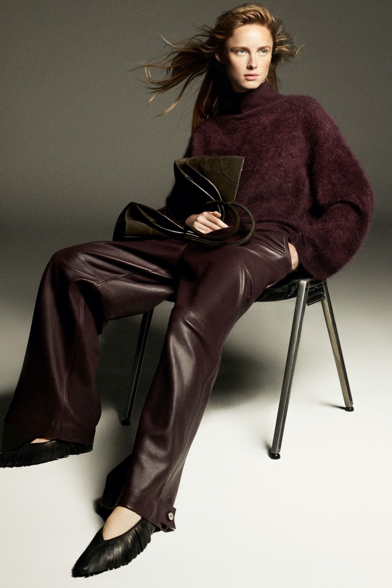 Rianne van Rompaey layers up in turtleneck sweater and leather pants for COS' fall 2024 ad.