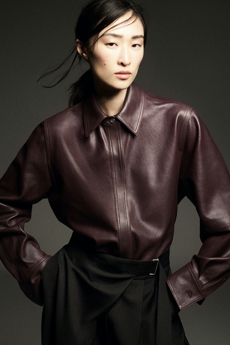 Chu Wong shows off a leather stitched shirt for COS' fall-winter 2024 campaign.