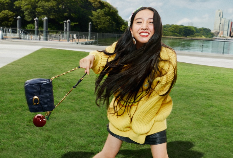 Koki appears in Coach's fall 2024 campaign wearing a vibrant look.