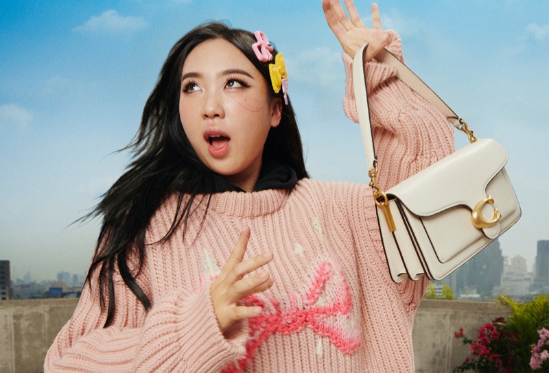 Youngji Lee is pretty in pink for Coach's fall 2024 campaign.