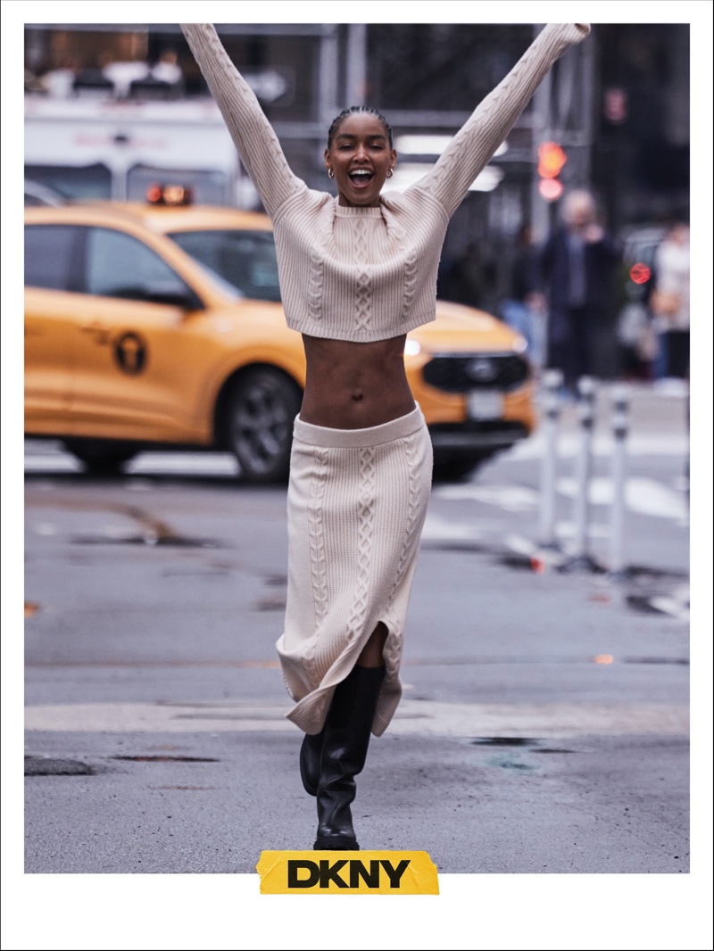 Blesnya Minher hits the streets of New York in knit pieces for DKNY's fall 2024 collection.