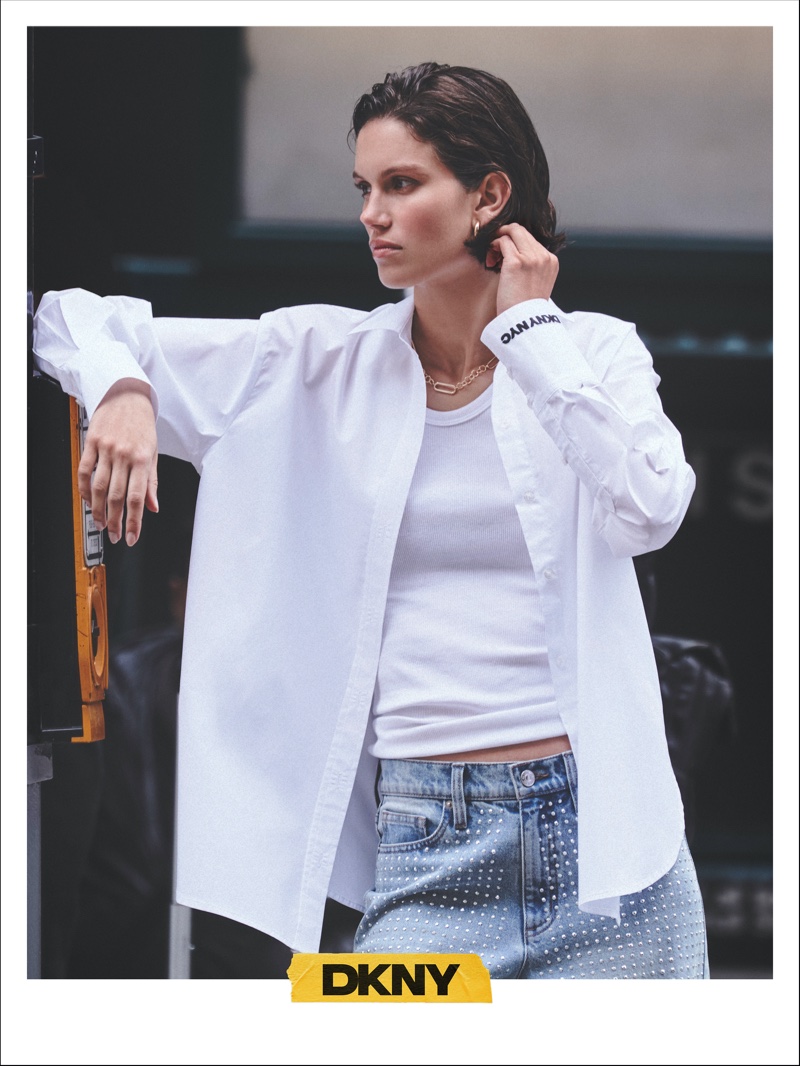 Ilana Hansen wears a casual shirt and jeans combination for DKNY's fall 2024 editorial campaign.