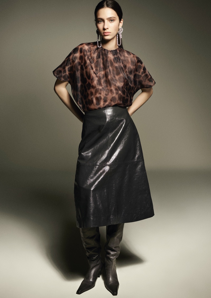 Loli Bahia models animal print blouse and faux leather skirt from H&M Studio's fall-winter 2024 line.