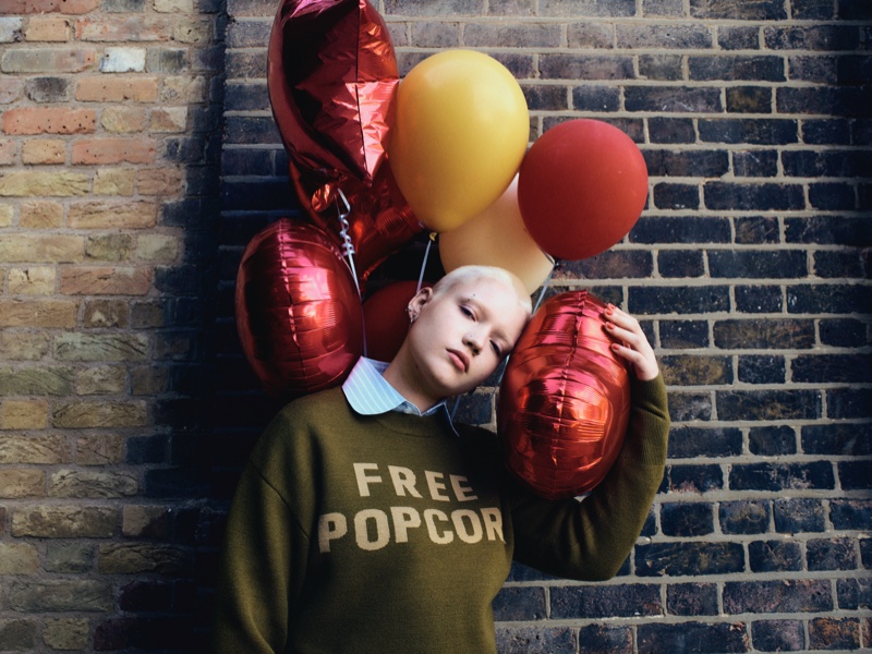 A model wears a Free Popcorn sweater from Harry Lambert x Zara's Cutie Circus collection.