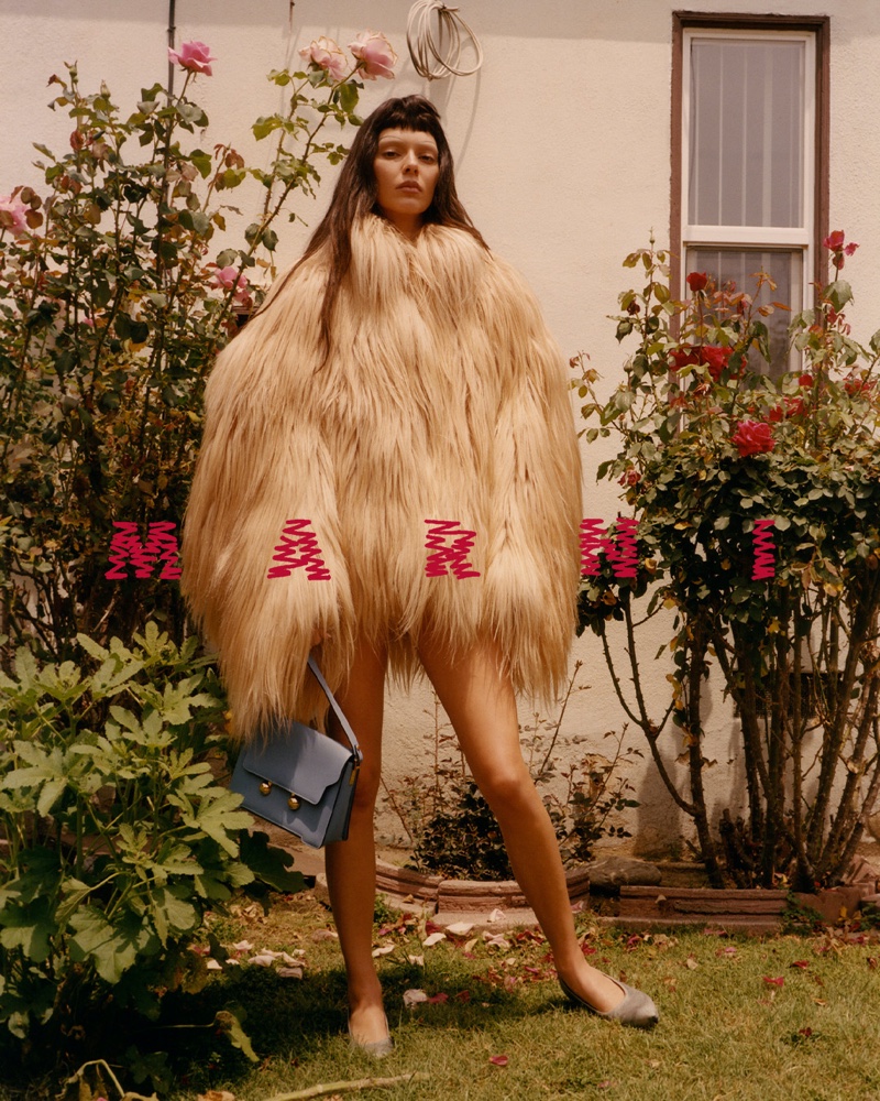 Kendall Jenner wears a faux fur coat with the Trunkaroo bag for Marni's fall 2024 ad.