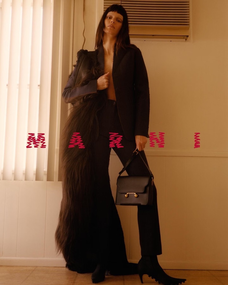 Modeling a black suit, Kendall Jenner appears in Marni's fall 2024 ad.