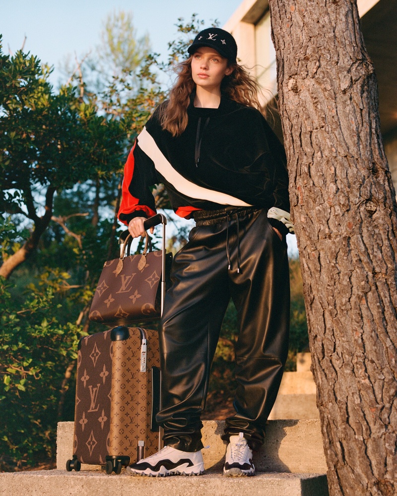 Keeping it casual, Louis Vuitton's Flight Mode fall 2024 collection includes leather joggers with the Horizon suitcase and OnTheGo bag.