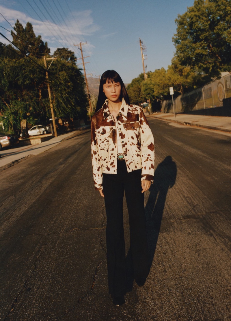 Mango spotlights a cow print jacket paired with wide-leg suit pants for a rugged look.