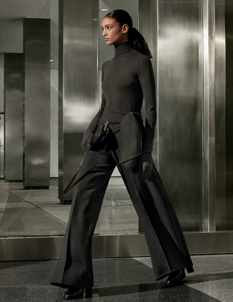 Max Mara delivers a charcoal grey knit and trousers with its fall 2024 campaign.