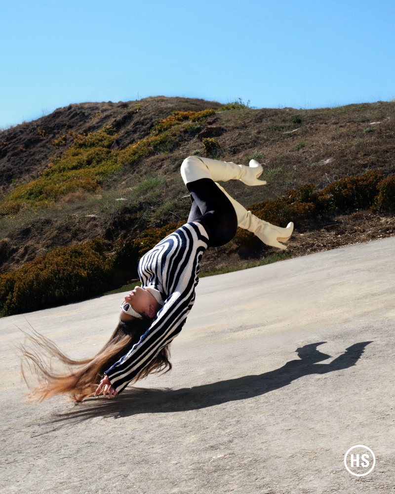 Singer Rosalía wears Bottega Veneta look with Wolford tights.