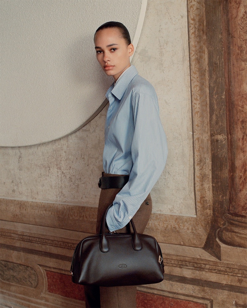 Annemary Aderibigbe models a striped button-up shirt in Tod's fall-winter 2024 campaign.