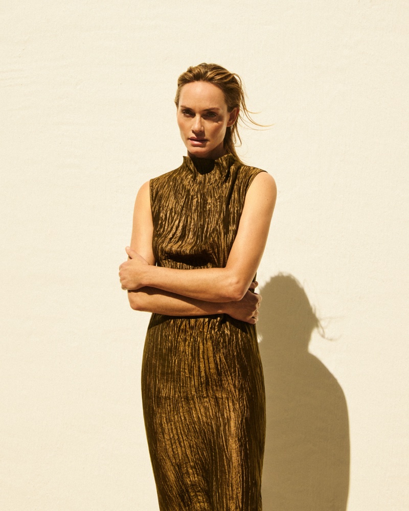 Amber Valletta poses in a pleated halter neck maxi dress from Massimo Dutti.