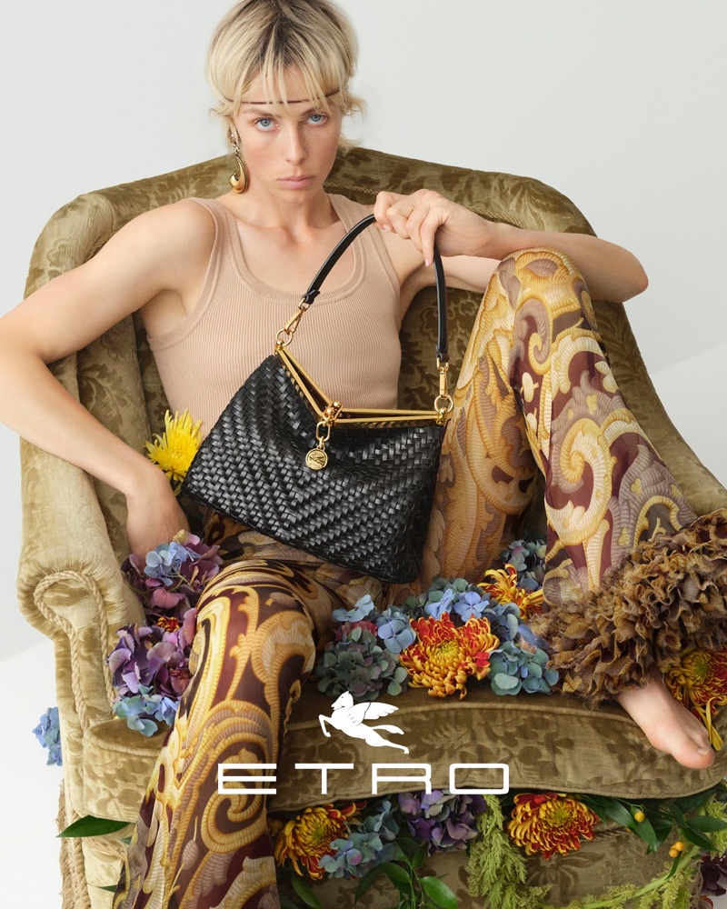 Edie Campbell lounges with the Etro Vela bag for fall 2024.