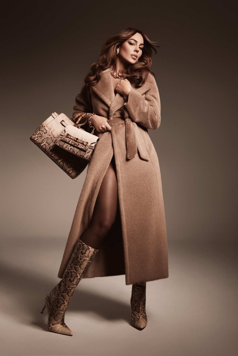 Wrapped up in a beige coat, Georgina Rodriguez fronts Guess' holiday 2024 ad.