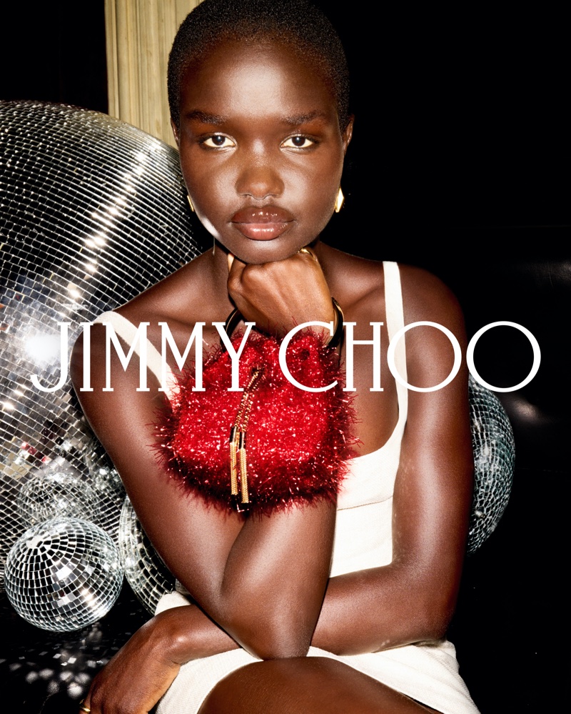 Jimmy Choo gets festive with the Micro Bon Bon beg in red tinsel for its winter 2024 campaign.