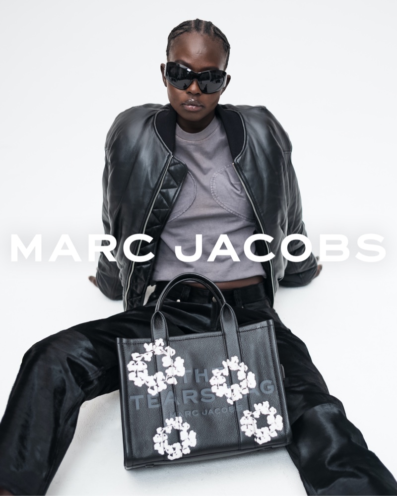 Aweng Chuol rocks a leather look with Marc Jacobs and Denim Tears' Tote Bag design.