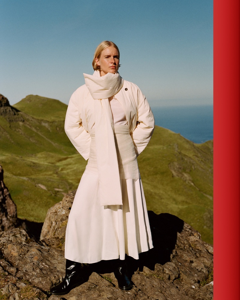 Massimo Dutti features an all-white ensemble with a puffer jacket and pleated skirt for the fall season.