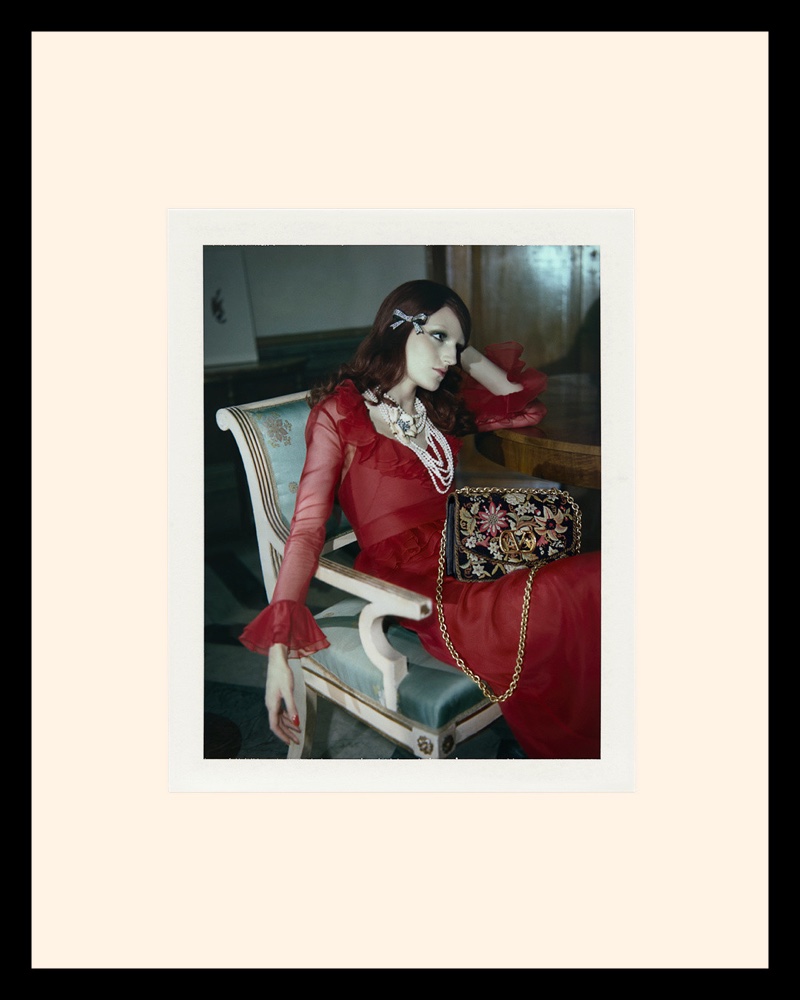 Valentino highlights a red dress for its resort 2025 campaign.