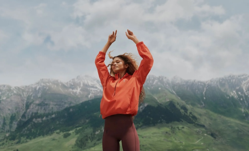 Zendaya embraces nature in an orange zip-up jacket for On's new campaign.