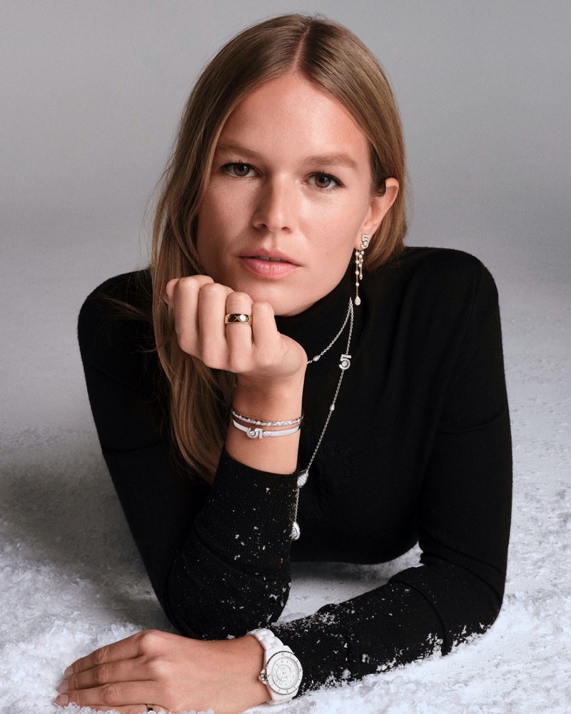 Anna Ewers poses in Chanel's J12 Caliber 12.2 watch, Collection N°5, and COCO CRUSH lines.