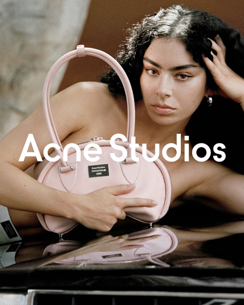 Posing with the Bowlina bag, Charli XCX fronts Acne Studios campaign.