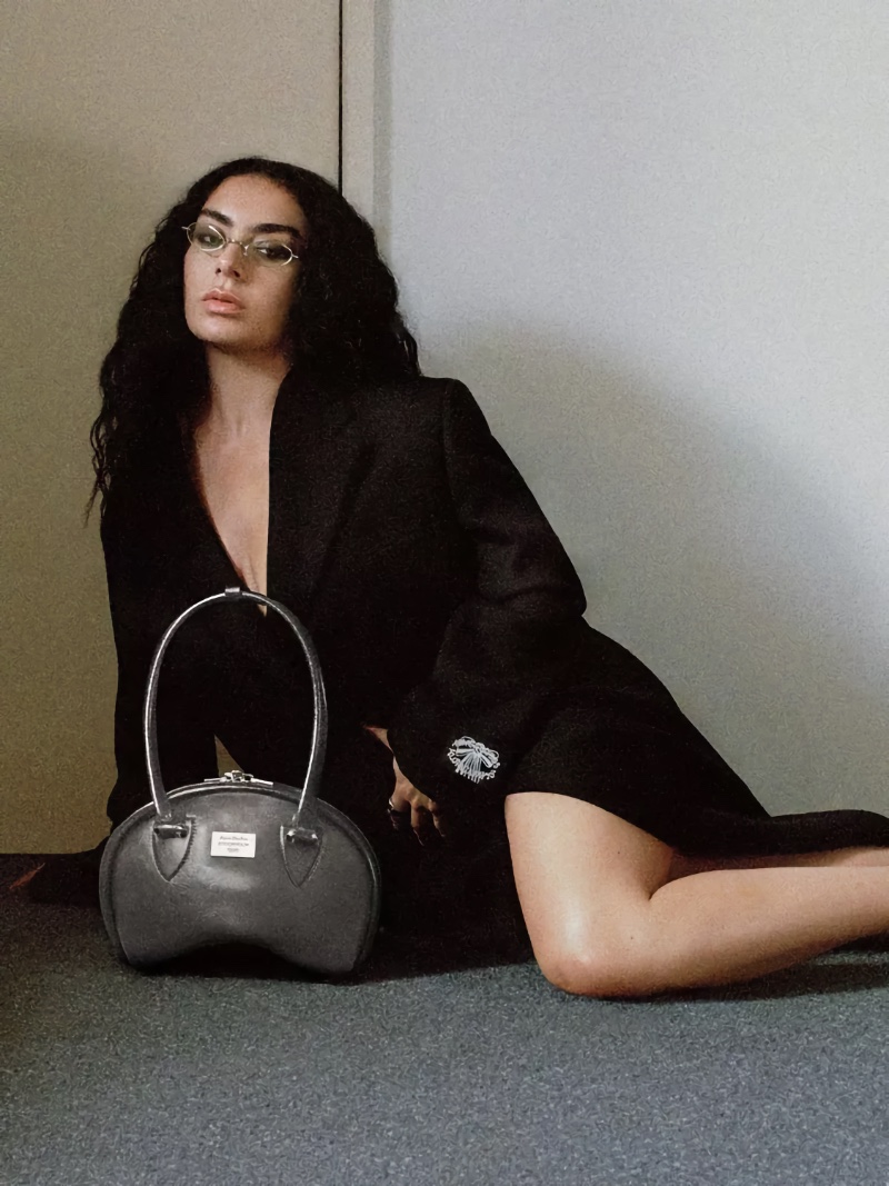 Wearing a jacket, Charli XCX gives minimal vibes for Acne Studios campaign.