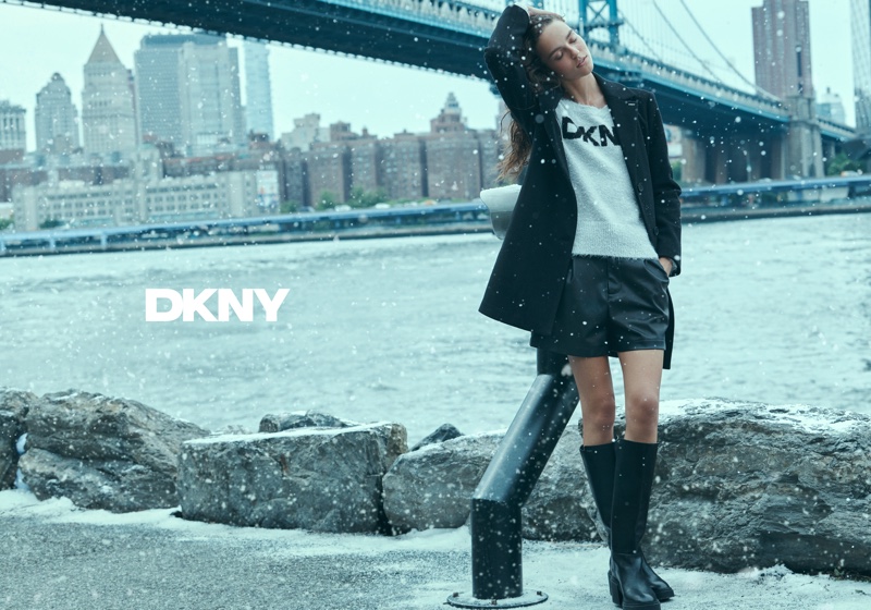 Emm Arruda poses in the snow for DKNY's Holiday 2024 campaign.