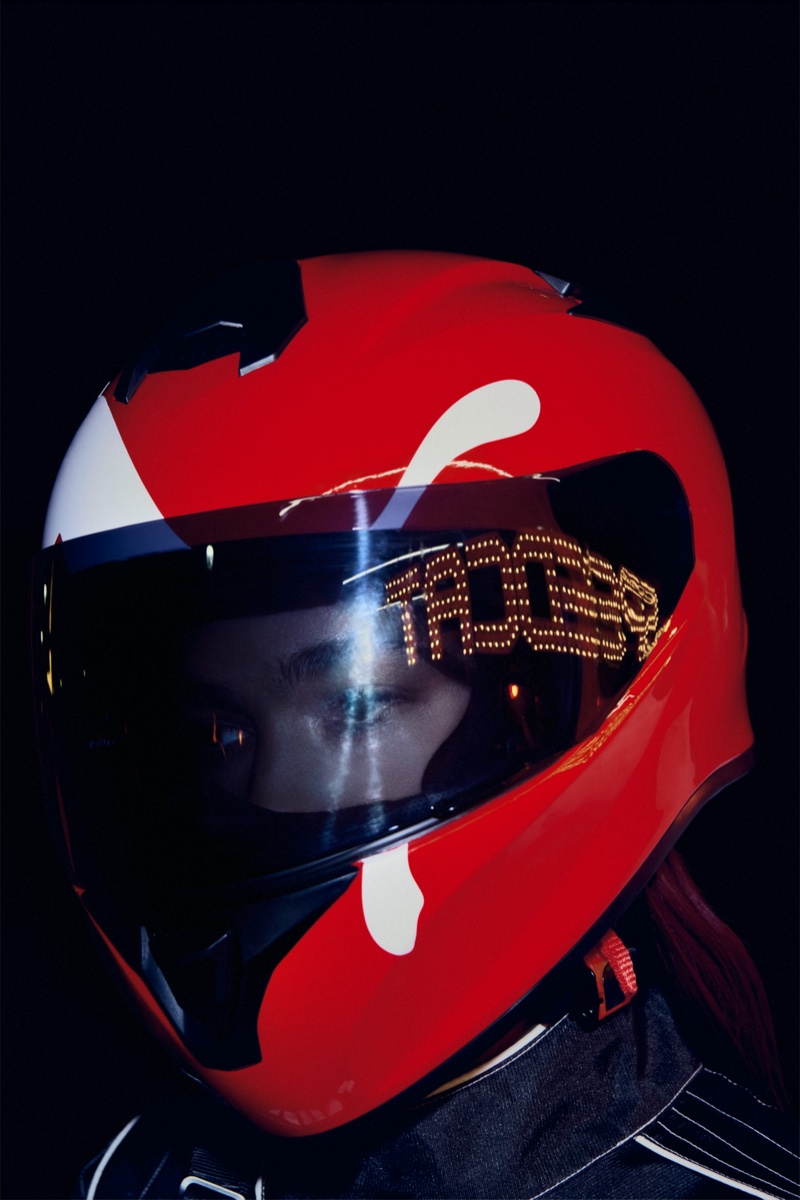 Dua Lipa wears a racing helmet in the PUMA Speedcat ad.