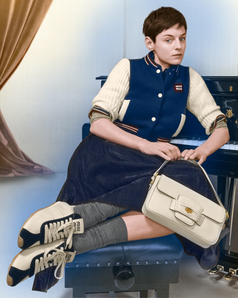 Emma Corrin wears a casual look in Miu Miu's Holiday 2024 ad.