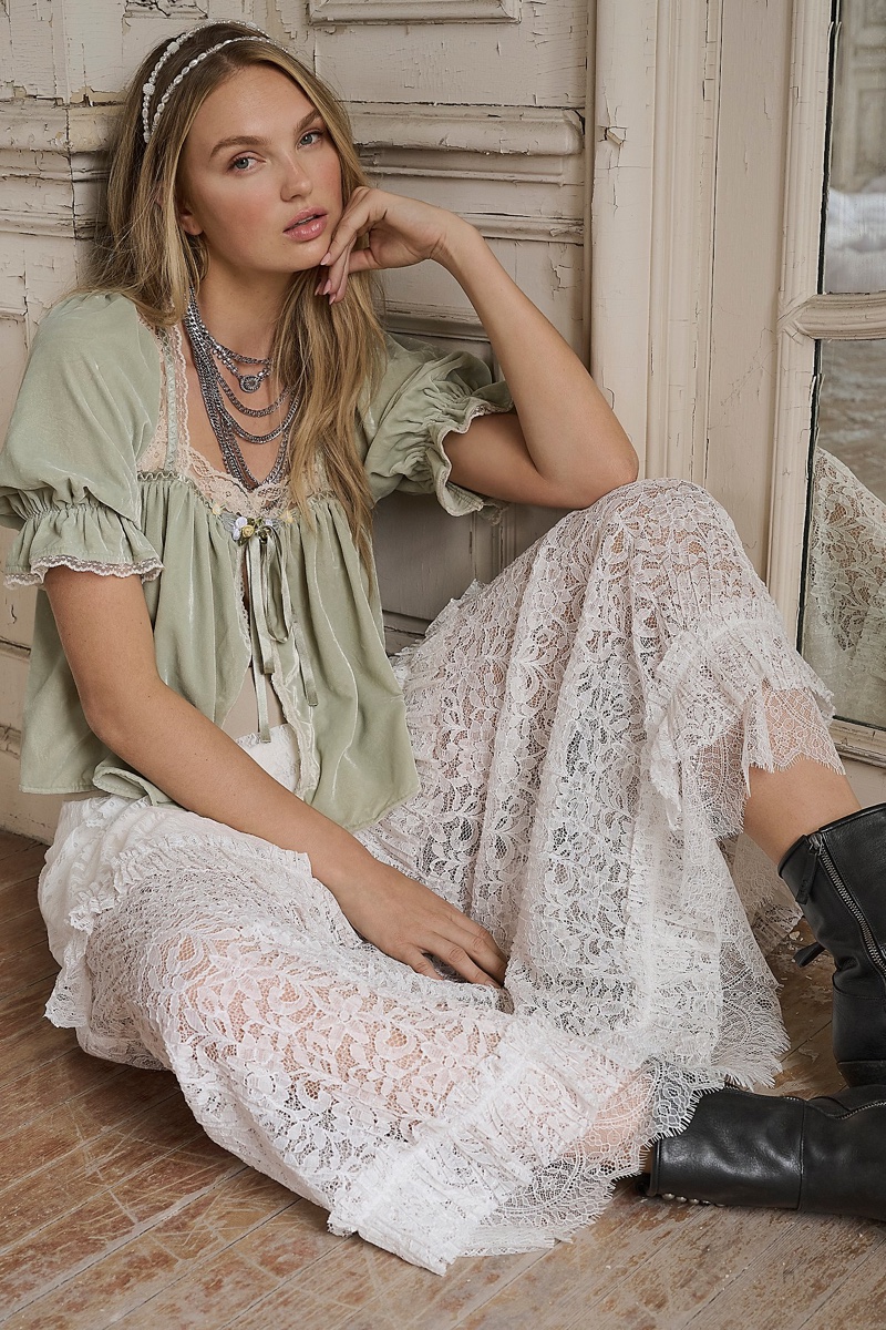 Free People spotlights the Lets Voyage Top and Arizona Maxi Skirt in its Holiday 2024 catalog.