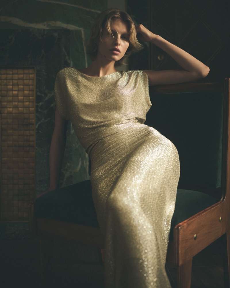 Karolina Spakowski shines in a gold dress for Loro Piana's Evening collection.