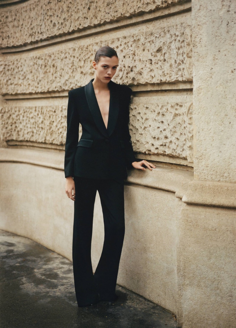 Alix Bouthors models Mango Capsule suit blazer with satin details and trousers.