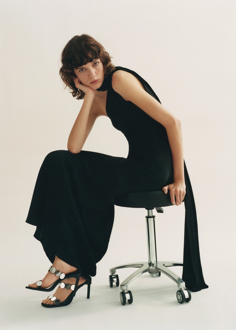 The winter 2024 Mango Capsule collection features an asymmetrical bow-neck dress.