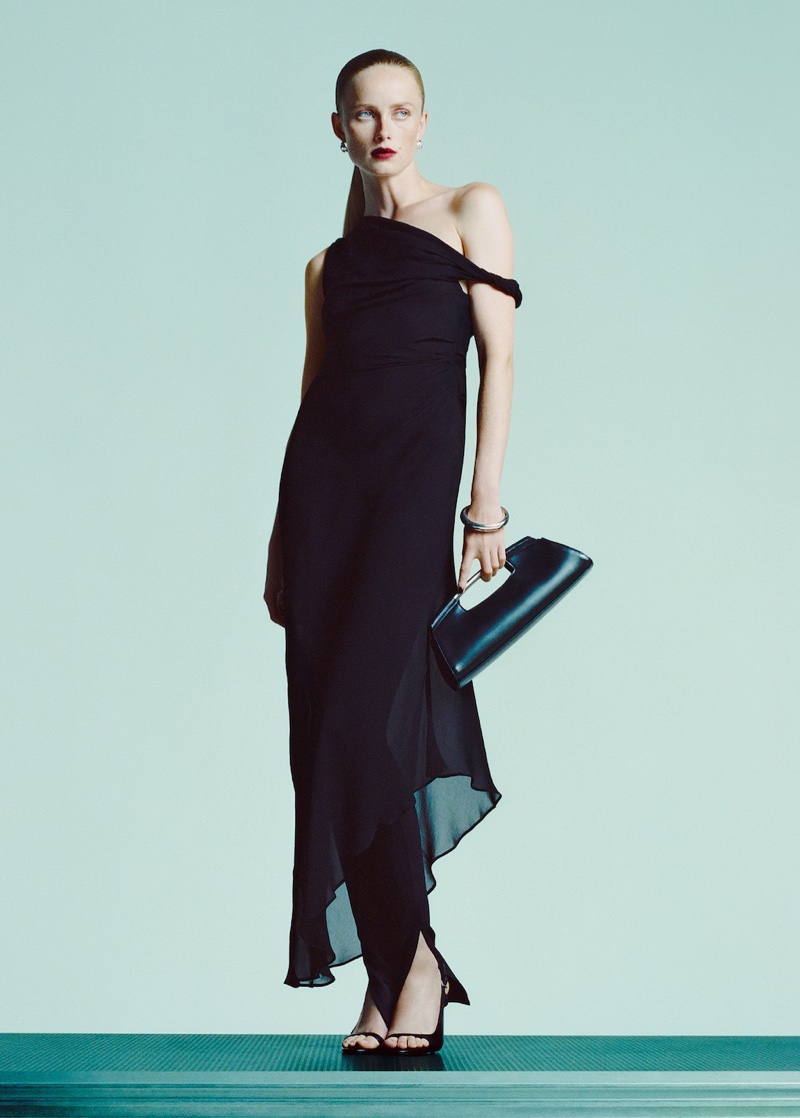 Mango unveils its Party Personas campaign, featuring a black asymmetrical dress.