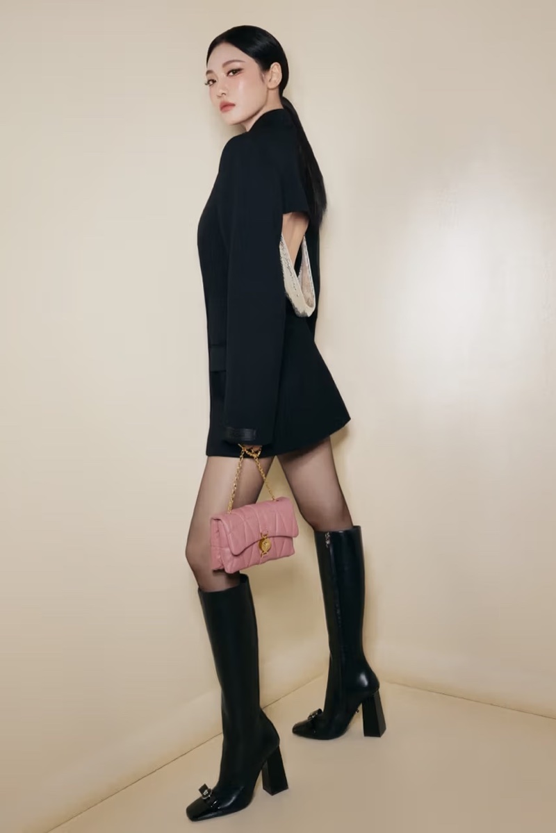 Aespa member NINGNING poses with the Kleio bag for Versace's Holiday 2024 ad.