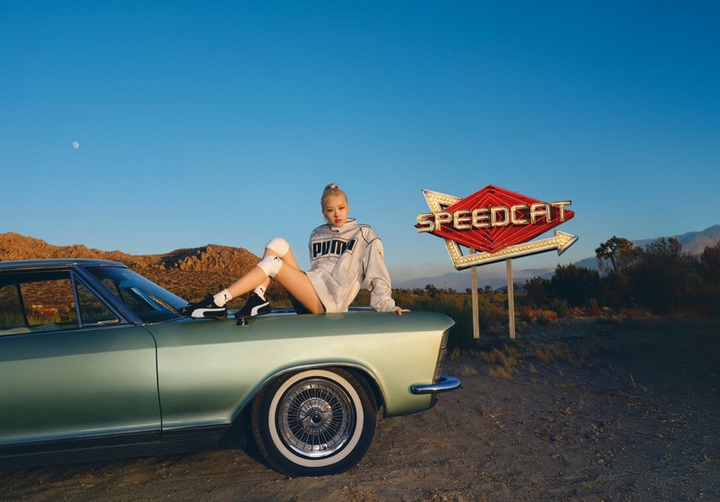 Posing in the desert, Rosé lounges on a car for the PUMA Speedcat campaign.