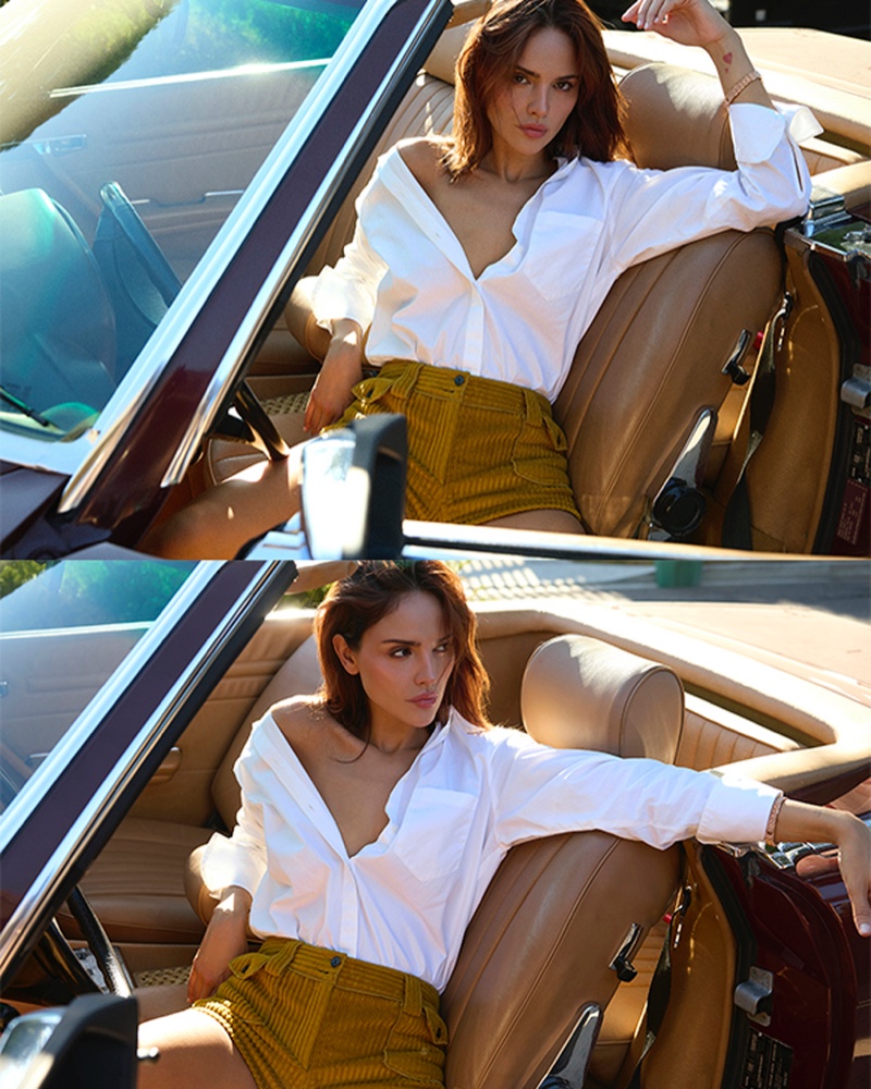 Posing in a convertible, Eiza González models a white shirt.