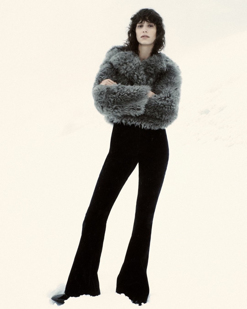 Mica Argañaraz poses in a short fluffy coat with flared pants from Massimo Dutti.