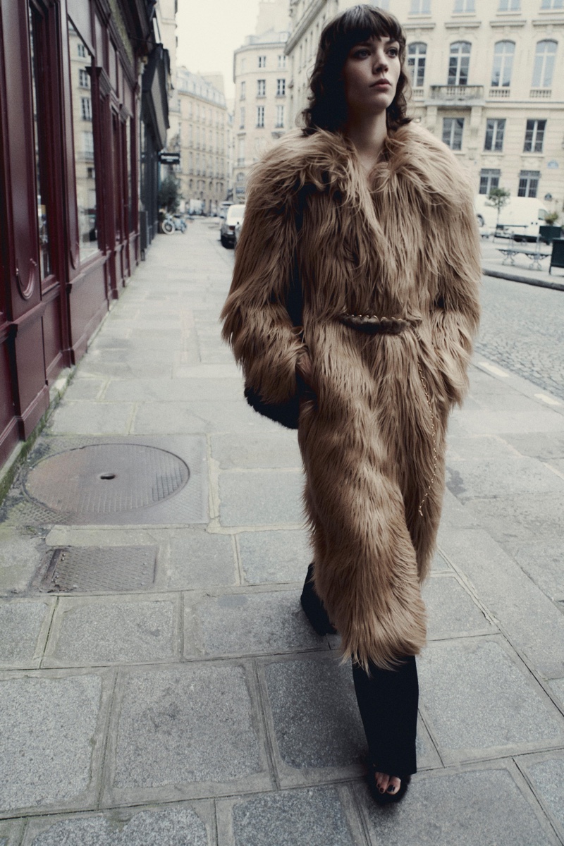 Alix Bouthors models Zara long faux fur coat and wide-leg pants.