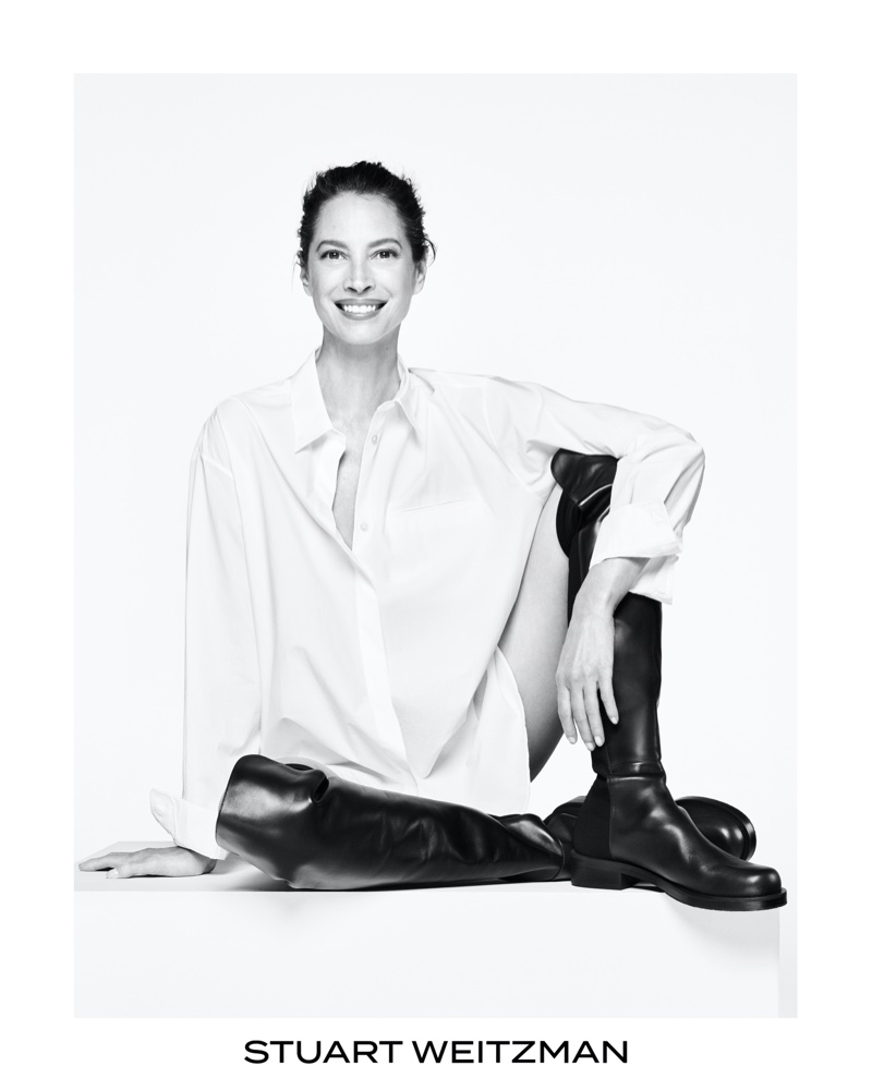 All smiles, Christy Turlington wears leather boots in new Stuart Weitzman campaign.