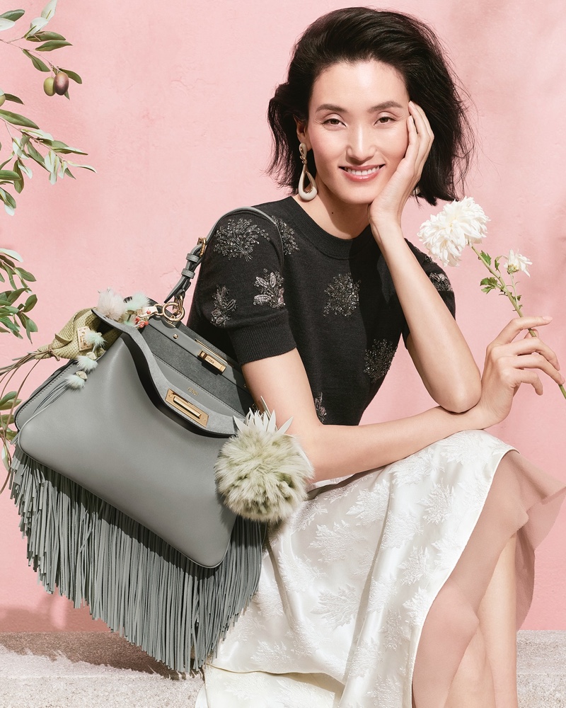 Lina Zhang models the Fendi Peekaboo bag with soft fringe details.