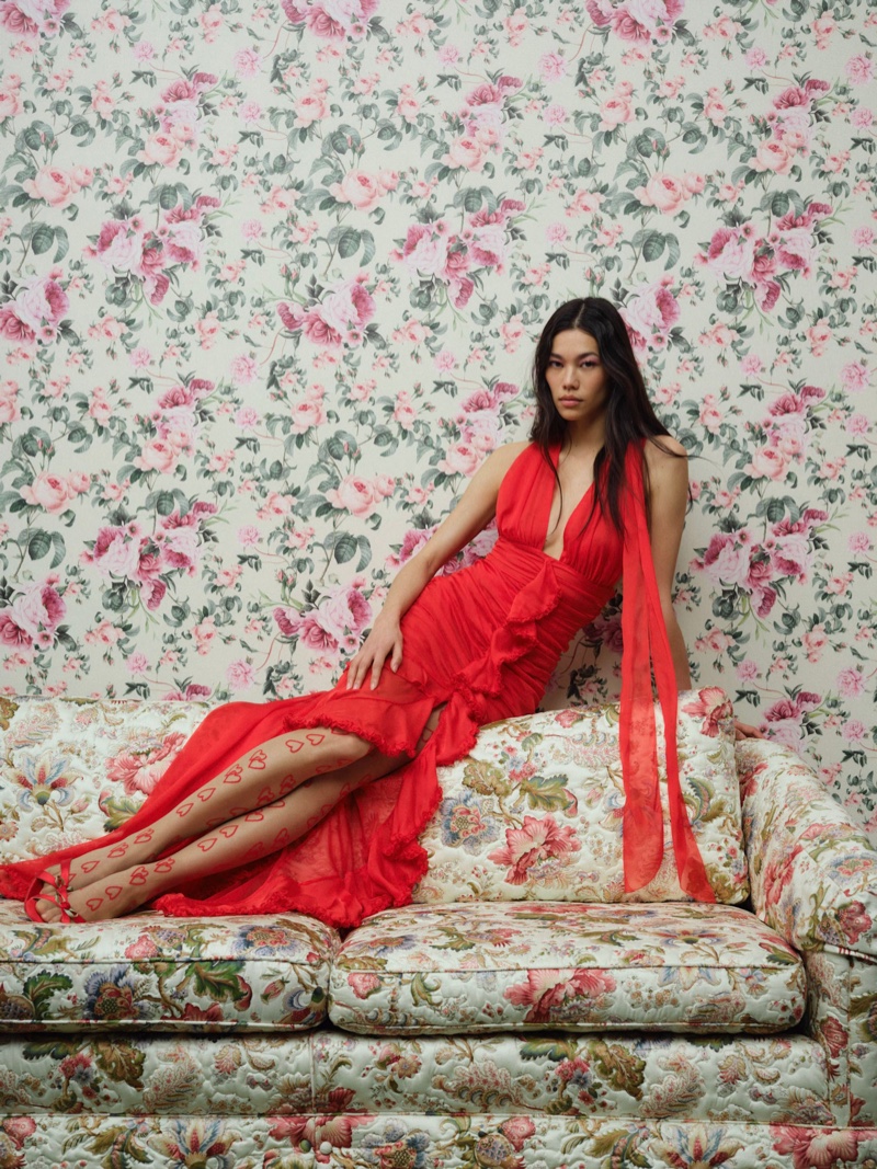 Jade Nguyen poses in a red Kayla gown from For Love & Lemons.